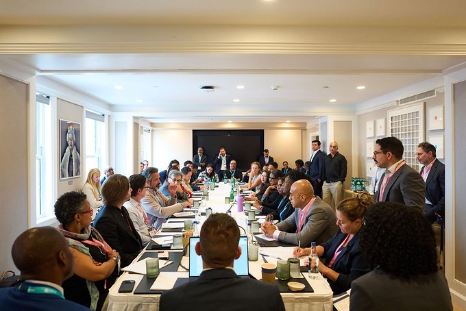 Members and guests seated around a long table at a BSA roundtable meeting